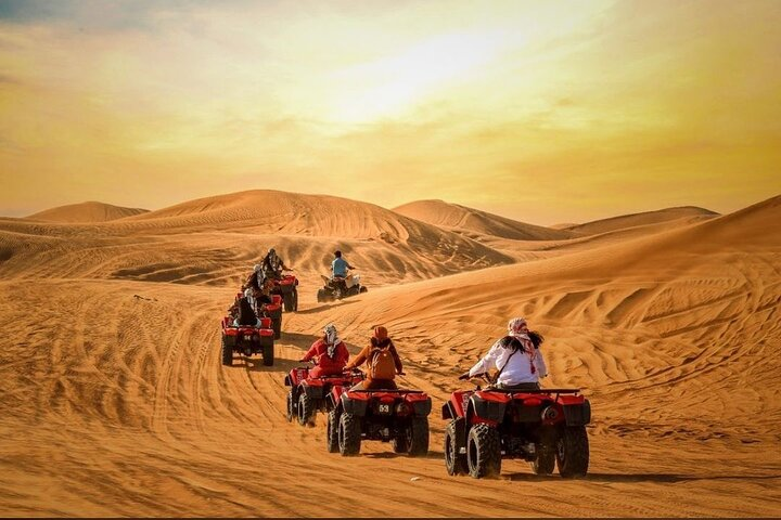 Experience the thrill of dune bashing across golden sand hills enjoy a unique camel ride and unleash your adventurous spirit with sandboarding in the stunning Dubai desert landscape.